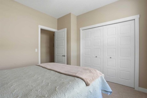 26 Cranbrook Villas Se, Calgary, AB - Indoor Photo Showing Bedroom