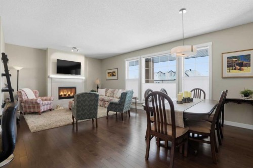 26 Cranbrook Villas Se, Calgary, AB - Indoor Photo Showing Other Room With Fireplace
