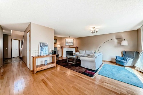 170 Shawbrooke Green Sw, Calgary, AB - Indoor Photo Showing Living Room With Fireplace