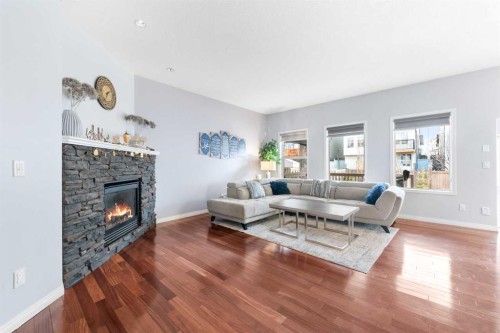 72 Panamount Heights Nw, Calgary, AB - Indoor Photo Showing Living Room With Fireplace