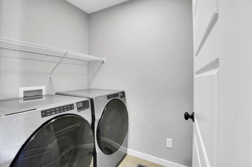 173 Setonstone Green Se, Calgary, AB - Indoor Photo Showing Laundry Room