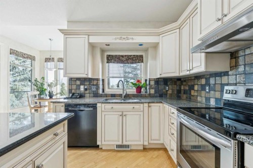 22 Valley Creek Road Nw, Calgary, AB - Indoor Photo Showing Kitchen With Double Sink