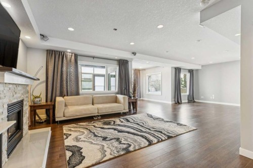 22 Valley Creek Road Nw, Calgary, AB - Indoor Photo Showing Living Room With Fireplace