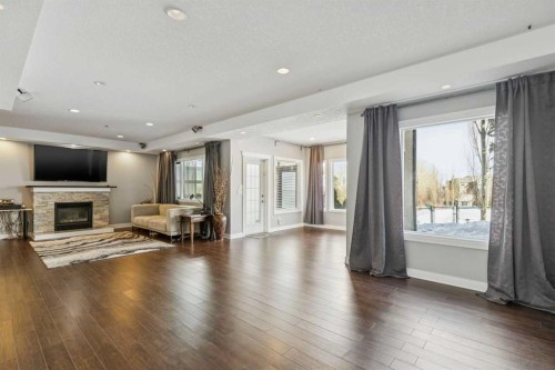 22 Valley Creek Road Nw, Calgary, AB - Indoor Photo Showing Living Room With Fireplace