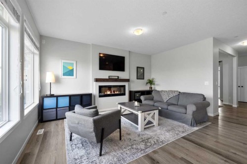 223 Howse Drive Ne, Calgary, AB - Indoor Photo Showing Living Room With Fireplace