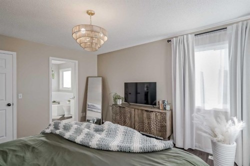 67 Silver Springs Way Nw, Airdrie, AB - Indoor Photo Showing Bedroom
