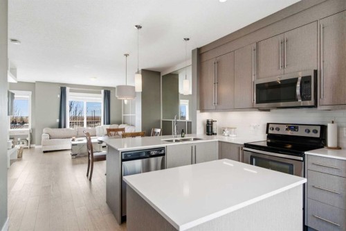 33-111 Rainbow Falls Gate, Chestermere, AB - Indoor Photo Showing Kitchen With Double Sink With Upgraded Kitchen