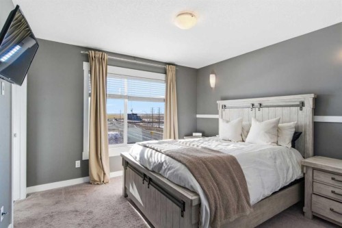 33-111 Rainbow Falls Gate, Chestermere, AB - Indoor Photo Showing Bedroom