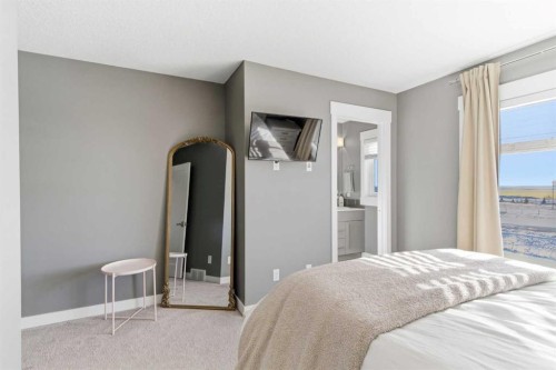 33-111 Rainbow Falls Gate, Chestermere, AB - Indoor Photo Showing Bedroom