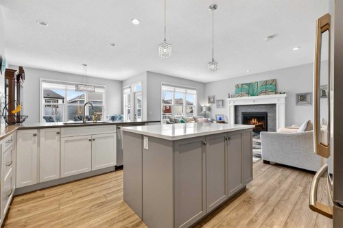 142 Masters Common Se, Calgary, AB - Indoor Photo Showing Kitchen With Fireplace