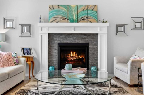 142 Masters Common Se, Calgary, AB - Indoor Photo Showing Living Room With Fireplace