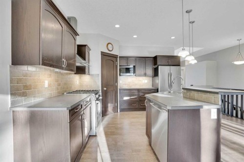 27-925 Imperial Drive, Diamond Valley, AB - Indoor Photo Showing Kitchen With Stainless Steel Kitchen With Upgraded Kitchen