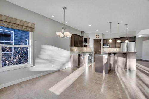 27-925 Imperial Drive, Diamond Valley, AB - Indoor Photo Showing Kitchen With Stainless Steel Kitchen With Upgraded Kitchen