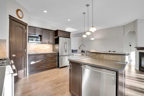27-925 Imperial Drive, Diamond Valley, AB - Indoor Photo Showing Kitchen With Stainless Steel Kitchen With Double Sink With Upgraded Kitchen
