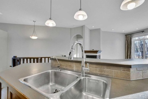 27-925 Imperial Drive, Diamond Valley, AB - Indoor Photo Showing Kitchen With Double Sink