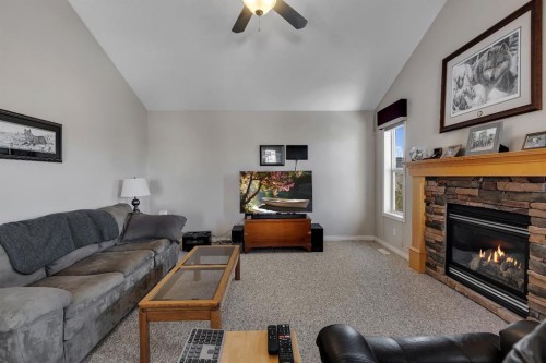 23 Evansbrooke Manor Nw, Calgary, AB - Indoor Photo Showing Living Room With Fireplace