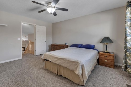 23 Evansbrooke Manor Nw, Calgary, AB - Indoor Photo Showing Bedroom