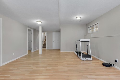 23 Evansbrooke Manor Nw, Calgary, AB - Indoor Photo Showing Other Room