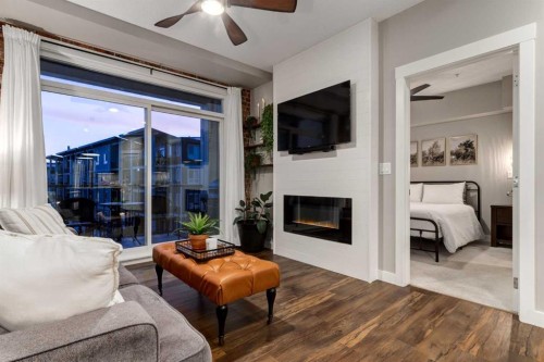 312-10 Walgrove Walk Se, Calgary, AB - Indoor Photo Showing Living Room With Fireplace
