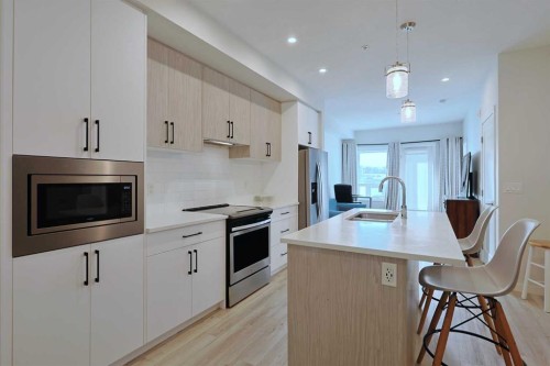 403-138 Sage Valley Common Nw, Calgary, AB - Indoor Photo Showing Kitchen With Upgraded Kitchen