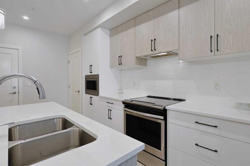 403-138 Sage Valley Common Nw, Calgary, AB - Indoor Photo Showing Kitchen With Double Sink