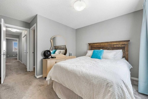 68 New Brighton Point Se, Calgary, AB - Indoor Photo Showing Bedroom