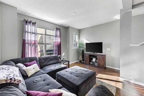 68 New Brighton Point Se, Calgary, AB - Indoor Photo Showing Living Room
