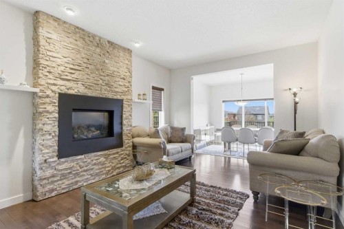 21 Evansview Manor Nw, Calgary, AB - Indoor Photo Showing Living Room With Fireplace
