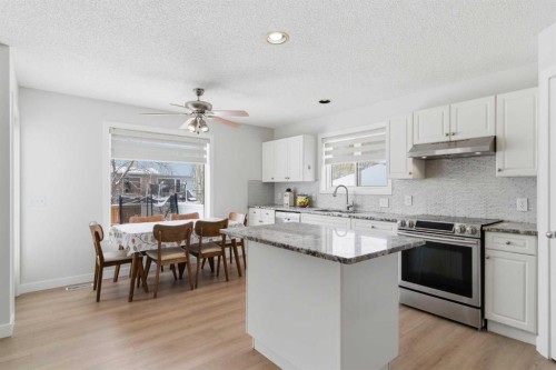 39 Arbour Ridge Mews Nw, Calgary, AB - Indoor Photo Showing Kitchen With Upgraded Kitchen