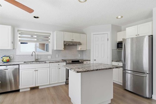 39 Arbour Ridge Mews Nw, Calgary, AB - Indoor Photo Showing Kitchen With Upgraded Kitchen