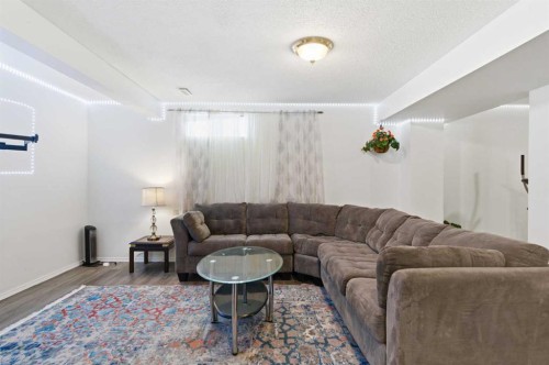 39 Arbour Ridge Mews Nw, Calgary, AB - Indoor Photo Showing Living Room
