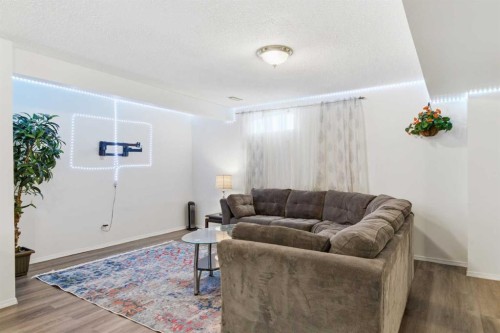 39 Arbour Ridge Mews Nw, Calgary, AB - Indoor Photo Showing Living Room