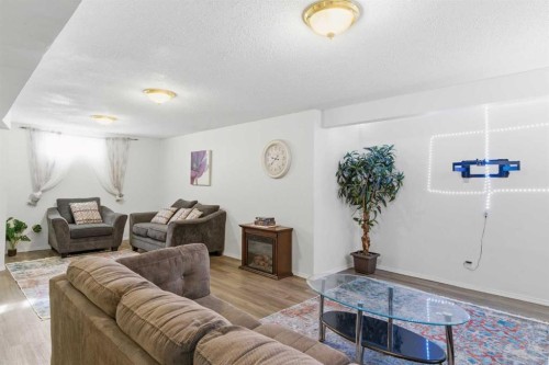 39 Arbour Ridge Mews Nw, Calgary, AB - Indoor Photo Showing Living Room