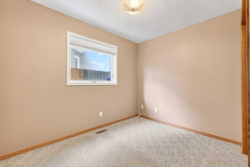 1208 Sunvista Way Se, Calgary, AB - Indoor Photo Showing Other Room