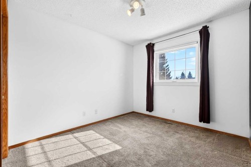 1208 Sunvista Way Se, Calgary, AB - Indoor Photo Showing Other Room