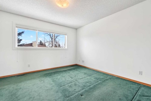 1208 Sunvista Way Se, Calgary, AB - Indoor Photo Showing Other Room