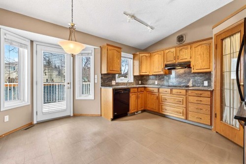 1208 Sunvista Way Se, Calgary, AB - Indoor Photo Showing Kitchen