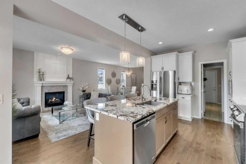 16 Nolancrest Circle Nw, Calgary, AB - Indoor Photo Showing Kitchen With Fireplace With Upgraded Kitchen