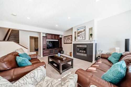 5 Bridle Estates Road Sw, Calgary, AB - Indoor Photo Showing Living Room With Fireplace