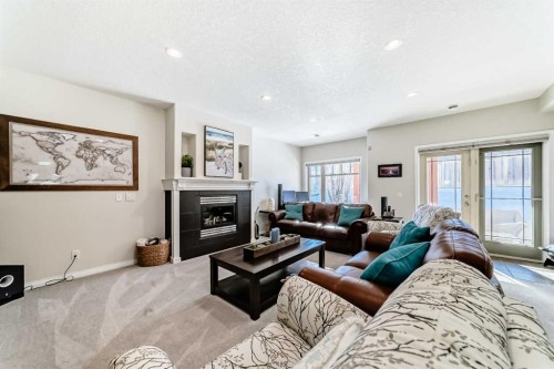 5 Bridle Estates Road Sw, Calgary, AB - Indoor Photo Showing Living Room With Fireplace