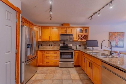 313-170 Crossbow Place, Canmore, AB - Indoor Photo Showing Kitchen With Double Sink