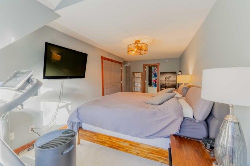 313-170 Crossbow Place, Canmore, AB - Indoor Photo Showing Bedroom