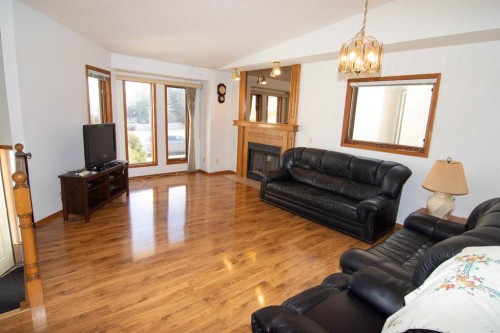 237 Sandarac Drive Nw, Calgary, AB - Indoor Photo Showing Living Room With Fireplace