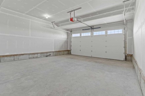 302 Kinniburgh Loop, Chestermere, AB - Indoor Photo Showing Garage