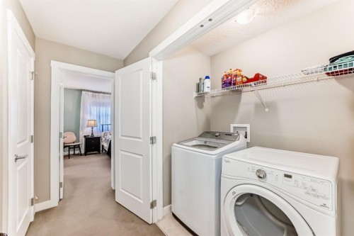 91 Baysprings Terrace, Airdrie, AB - Indoor Photo Showing Laundry Room