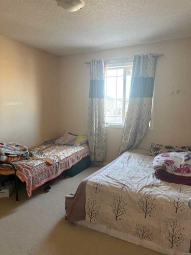 35 Saddlebrook Link Ne, Calgary, AB - Indoor Photo Showing Bedroom