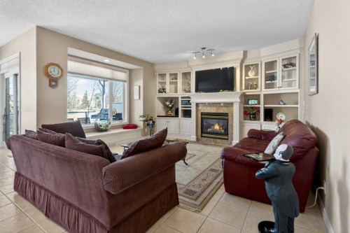 4754 Hamptons Way Nw, Calgary, AB - Indoor Photo Showing Living Room With Fireplace