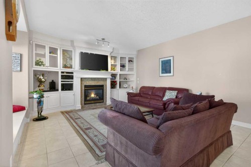 4754 Hamptons Way Nw, Calgary, AB - Indoor Photo Showing Living Room With Fireplace