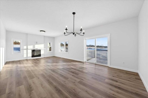 3 Lakewood Way, Strathmore, AB - Indoor Photo Showing Living Room With Fireplace