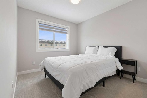 556 Chelsea Gardens, Chestermere, AB - Indoor Photo Showing Bedroom